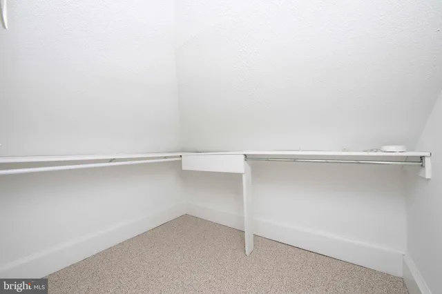 a view of an empty walk in closet