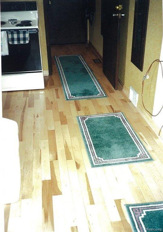 4745 East Allen Road Howell, MI 48855 - Photo 22 of 23 maple flooring in hallway.jpg