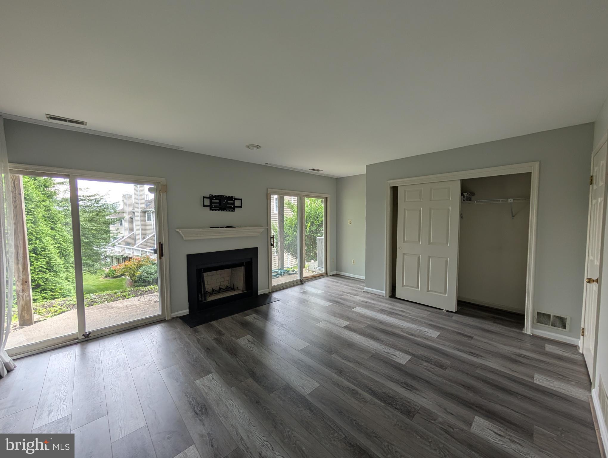 39 Cabot Drive Chesterbrook, PA 19087 - Photo 22 of 25 a view of a livingroom with wooden floor a fireplace and window
