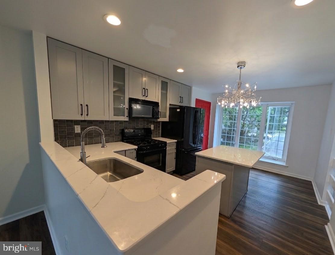 39 Cabot Drive Chesterbrook, PA 19087 - Photo 3 of 25 a kitchen with stainless steel appliances granite countertop a sink stove and refrigerator