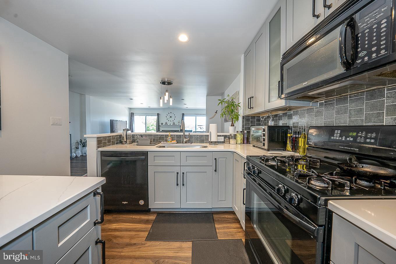 39 Cabot Drive Chesterbrook, PA 19087 - Photo 5 of 25 a kitchen with a sink appliances and cabinets