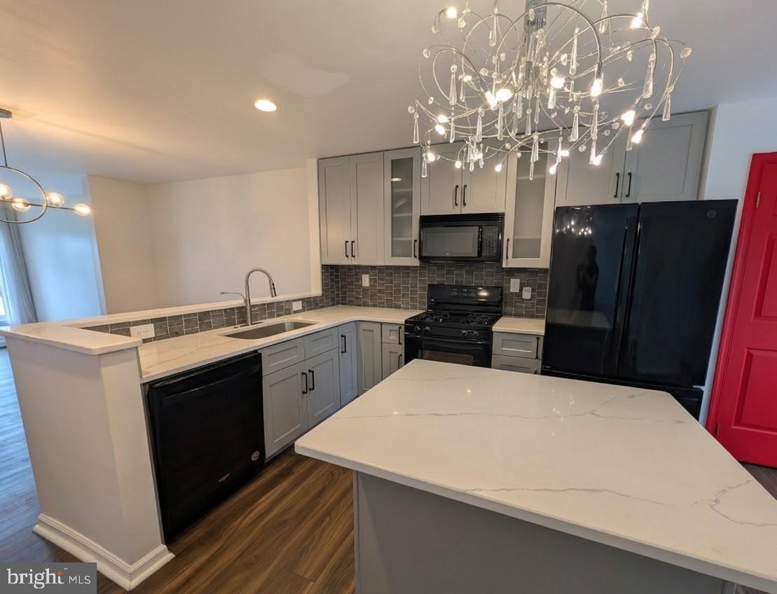 39 Cabot Drive Chesterbrook, PA 19087 - Photo 7 of 25 a kitchen with stainless steel appliances a refrigerator sink and microwave