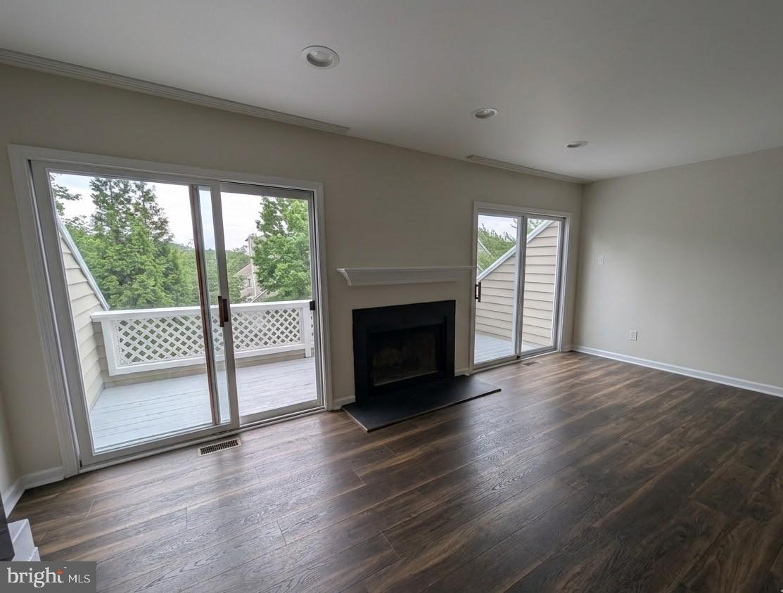 39 Cabot Drive Chesterbrook, PA 19087 - Photo 9 of 25 a view of a livingroom with wooden floor and a fireplace