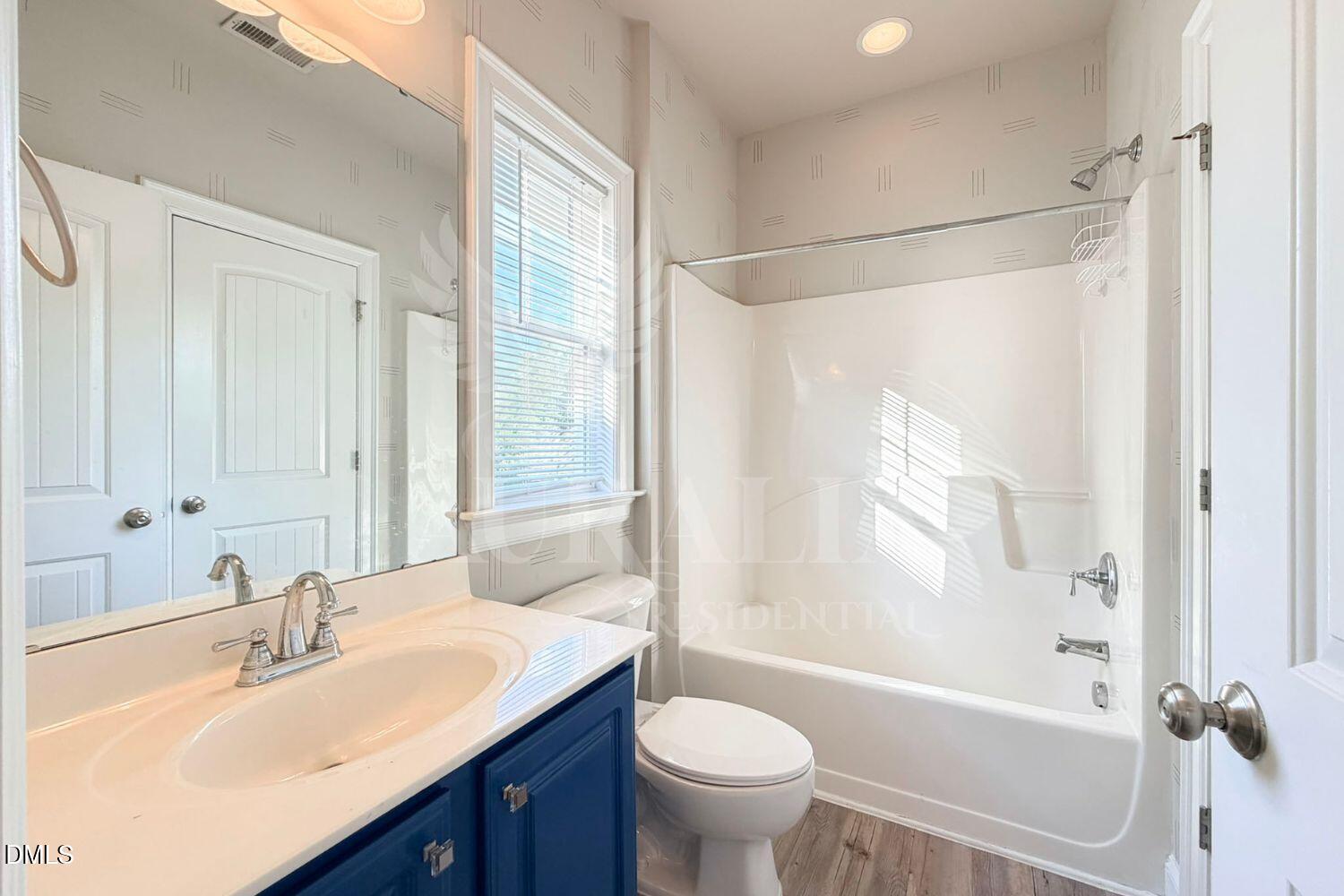 7754 ACC Boulevard Raleigh, NC 27617 - Photo 26 of 41 a bathroom with a sink toilet tub and shower