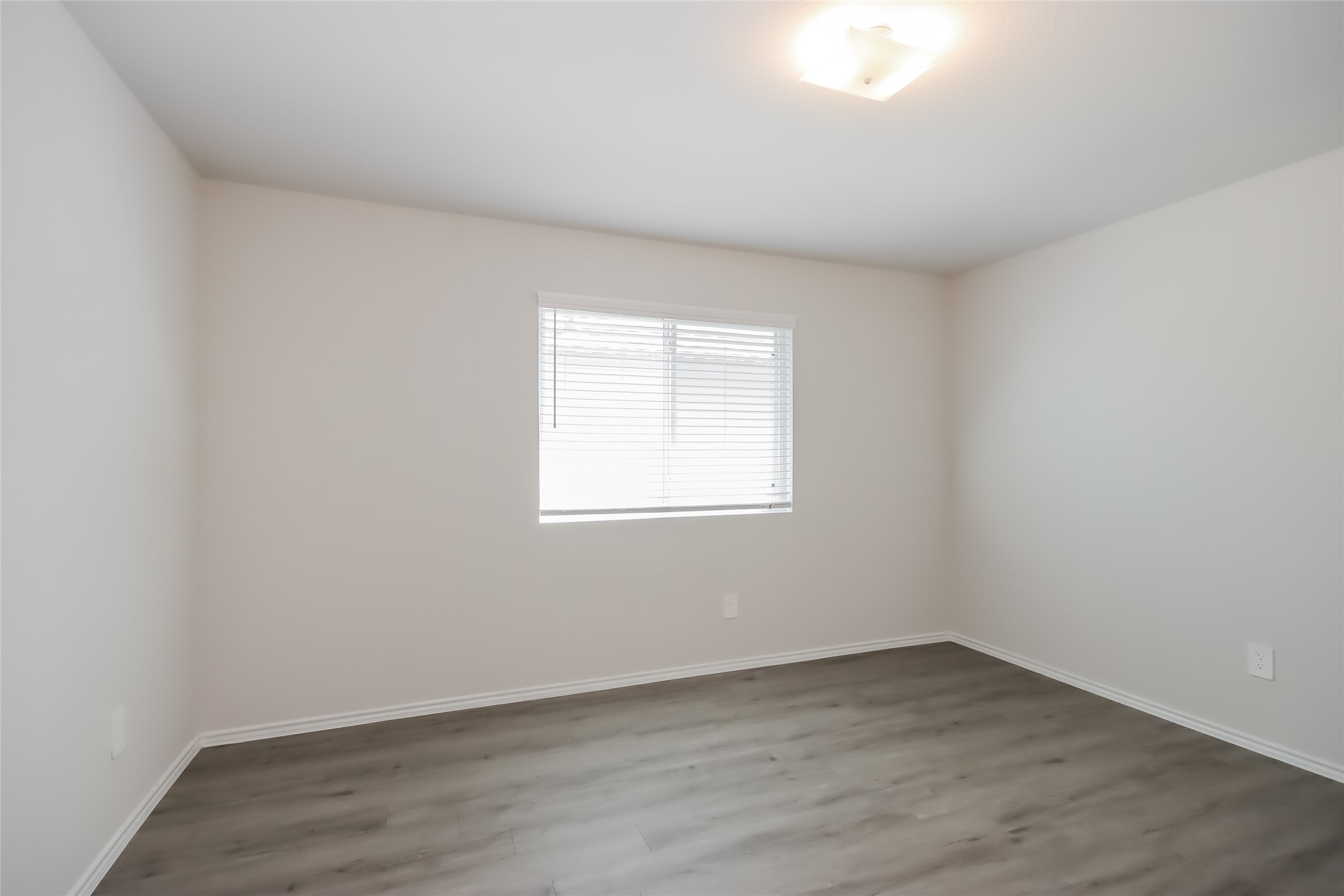 5031 Sessile Trail Spring, TX 77373 - Photo 15 of 19 wooden floor in an empty room with a window