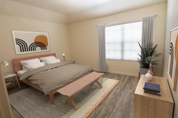 a bedroom with a bed and a window