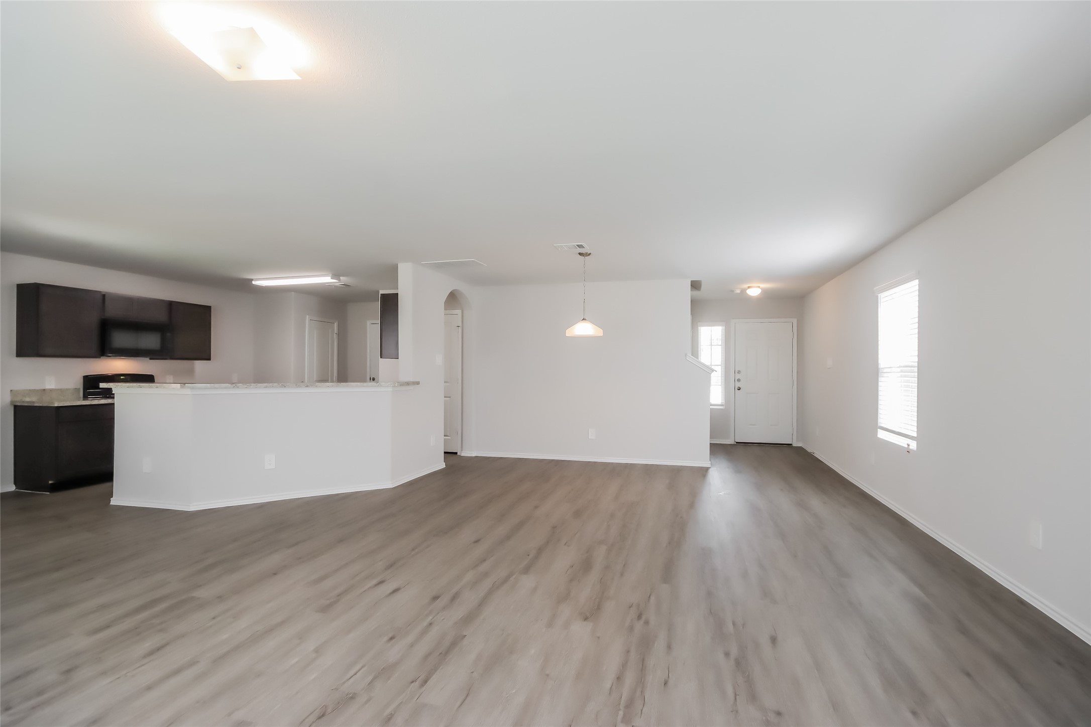 5031 Sessile Trail Spring, TX 77373 - Photo 5 of 19 a view of a kitchen with microwave and cabinets