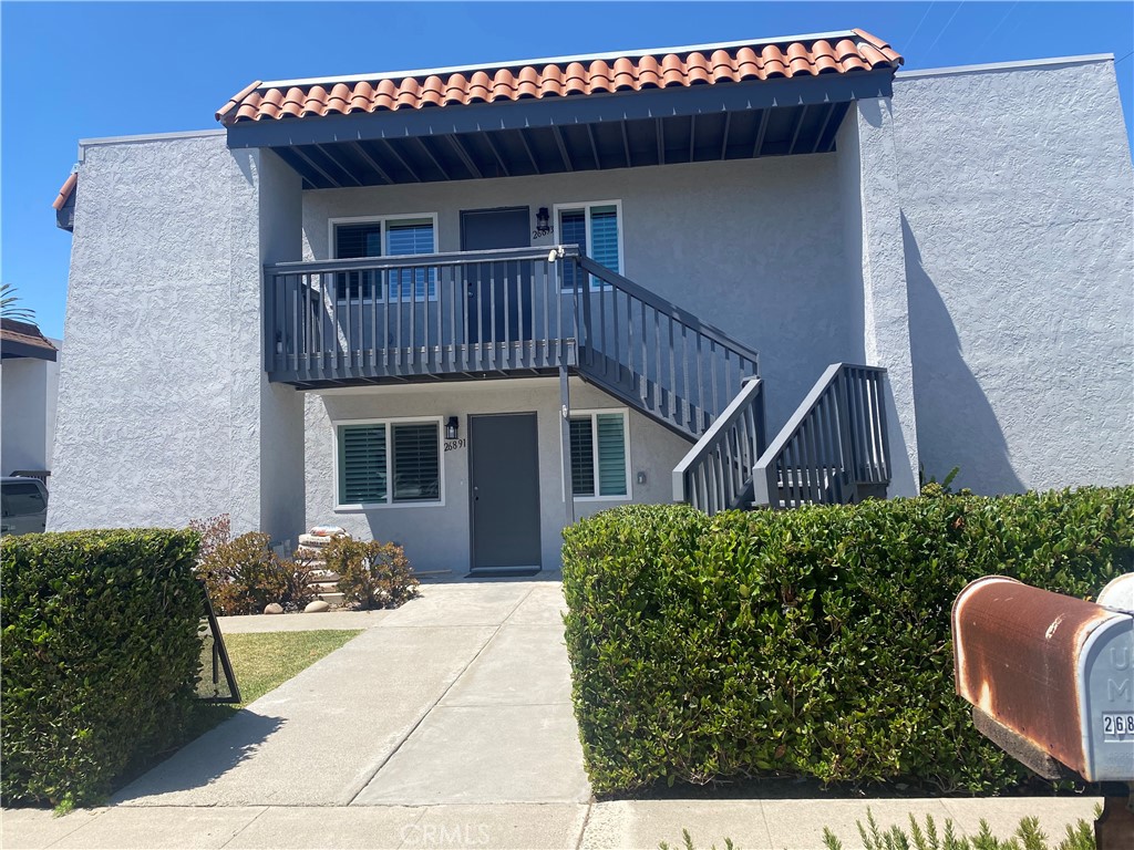 26891 Vista Del Mar, Unit A Dana Point, CA 92624 - Photo 2 of 25 a front view of a house with garden