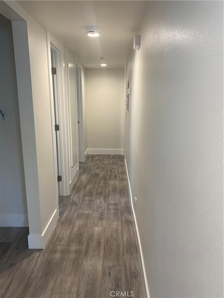 26891 Vista Del Mar, Unit A Dana Point, CA 92624 - Photo 22 of 25 a view of hallway with wooden floor