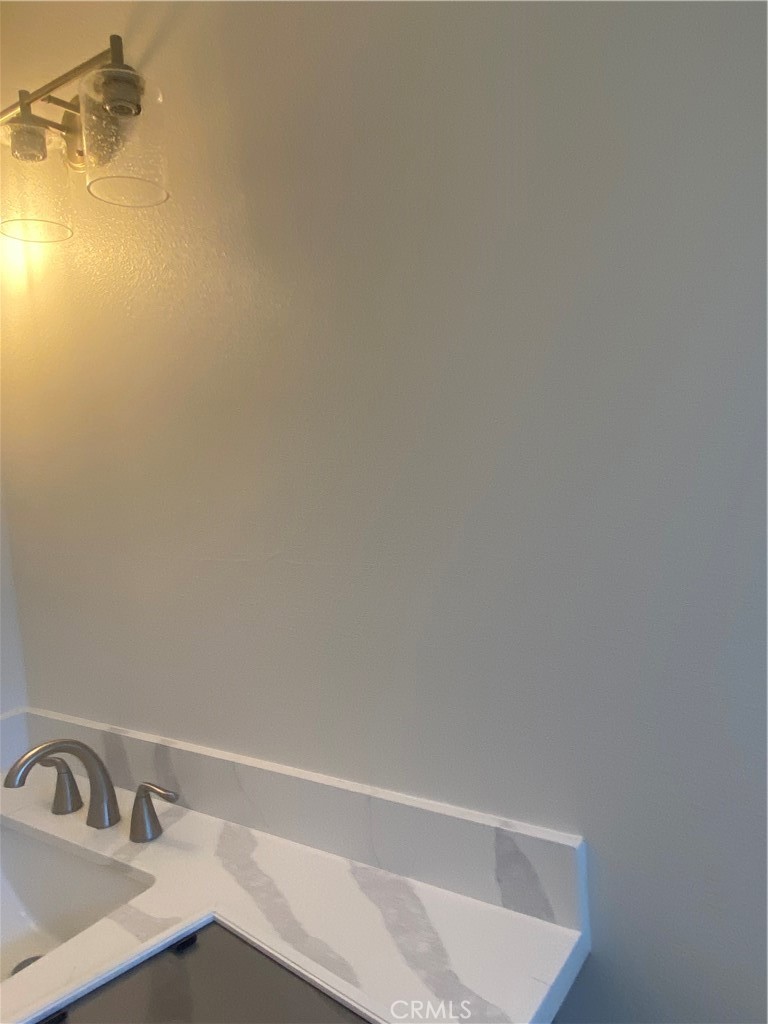 26891 Vista Del Mar, Unit A Dana Point, CA 92624 - Photo 24 of 25 a bathroom with a sink and vanity