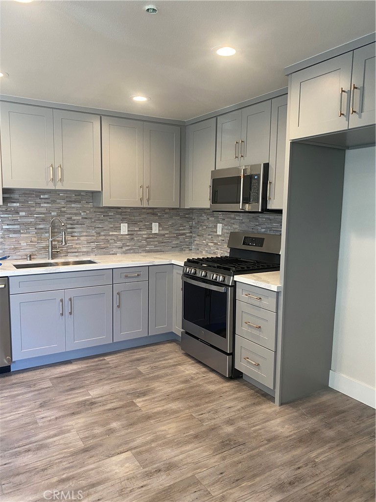 26891 Vista Del Mar, Unit A Dana Point, CA 92624 - Photo 3 of 25 a kitchen with stainless steel appliances granite countertop a stove a sink and a refrigerator