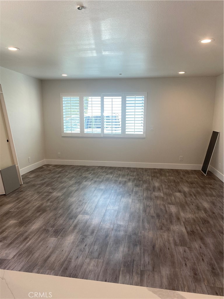 26891 Vista Del Mar, Unit A Dana Point, CA 92624 - Photo 4 of 25 an empty room with wooden floor and windows