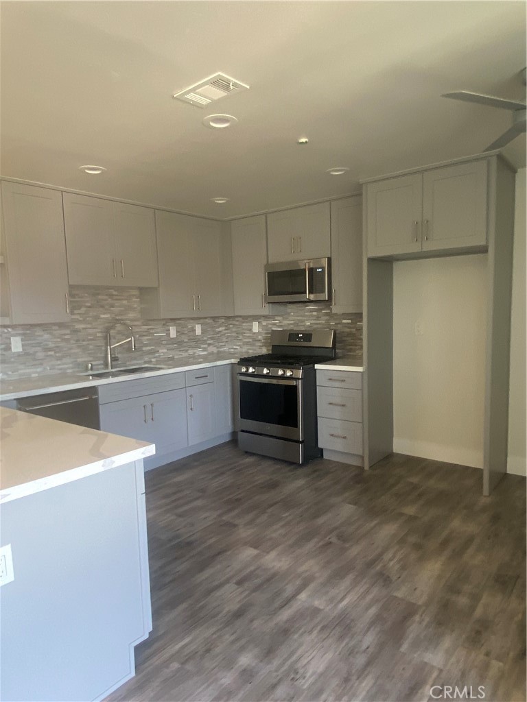 26891 Vista Del Mar, Unit A Dana Point, CA 92624 - Photo 8 of 25 a kitchen with stainless steel appliances granite countertop a stove top oven a sink and a refrigerator