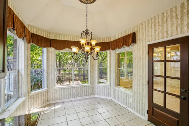 a view of an entryway with a floor to ceiling window and stairs