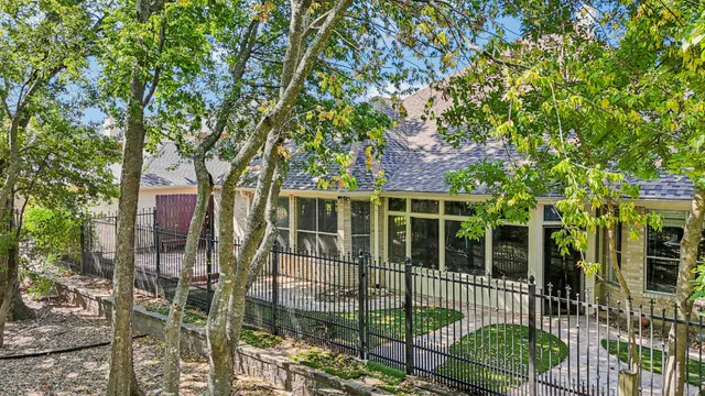 a view of house with backyard and outdoor seating