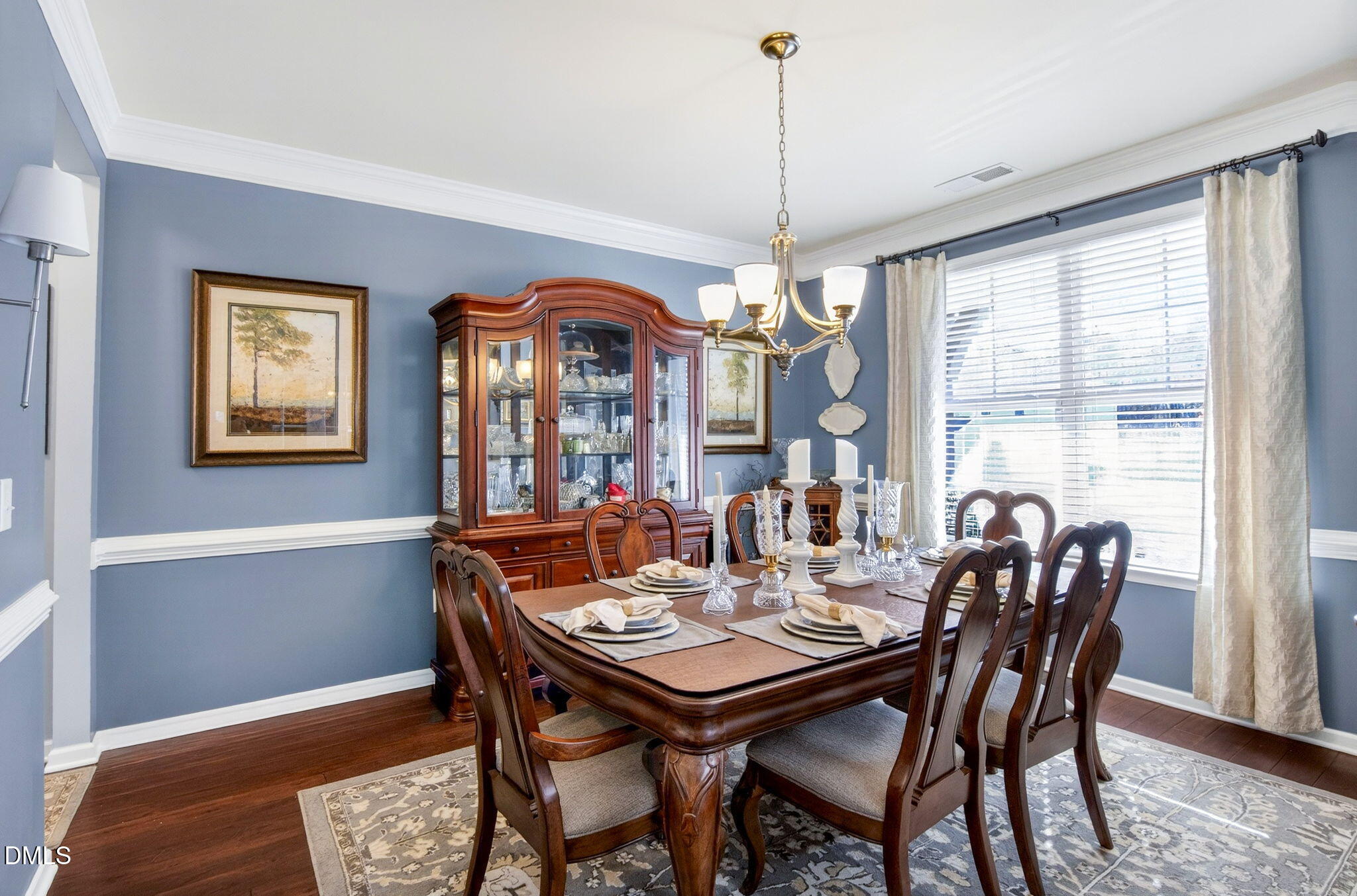 307 Marbella Drive Rolesville, NC 27571 - Photo 11 of 65 a view of a dining room with furniture window and wooden floor