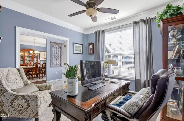 a dining room with stainless steel appliances kitchen island a table and chairs
