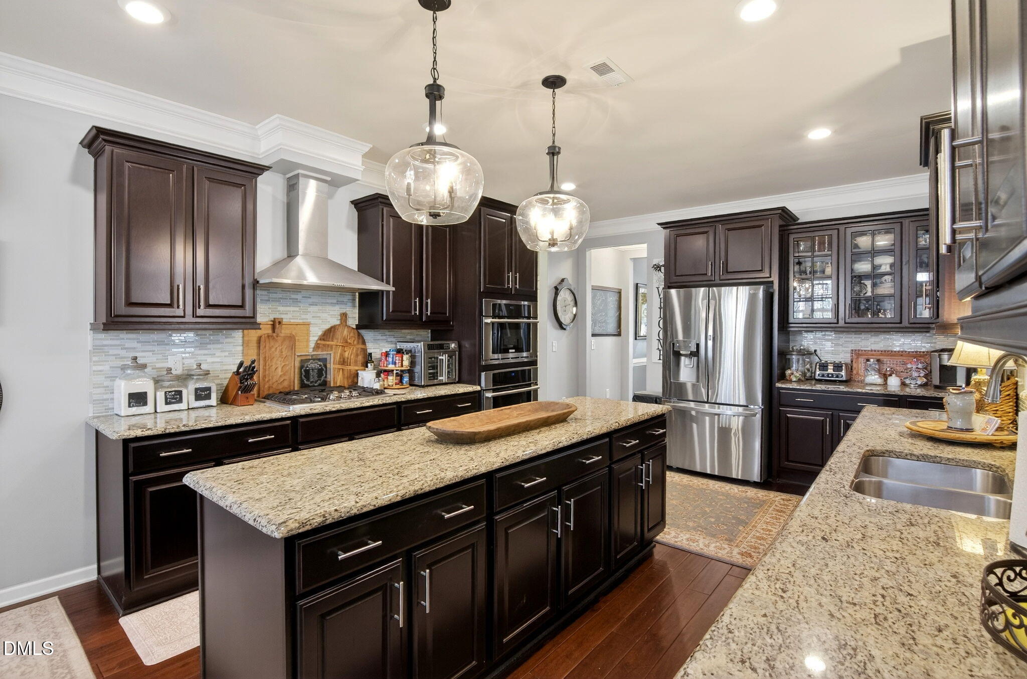 307 Marbella Drive Rolesville, NC 27571 - Photo 27 of 65 a large kitchen with granite countertop a sink and a stove