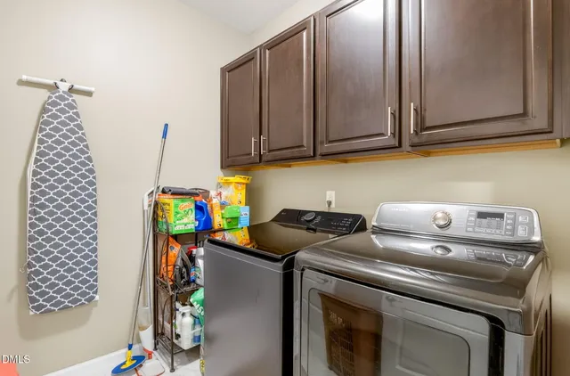 a en suite bathroom with a double vanity sink a mirror and a shower