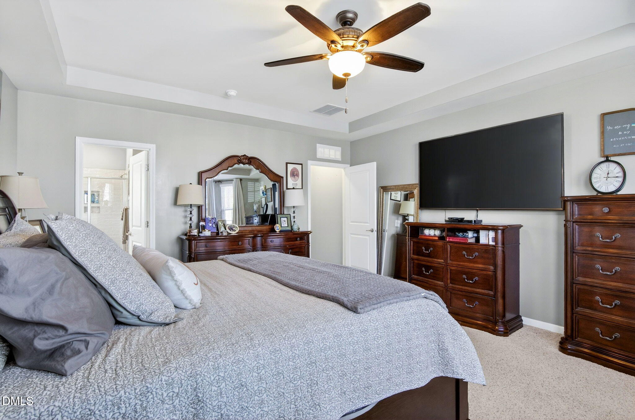 307 Marbella Drive Rolesville, NC 27571 - Photo 35 of 65 a bedroom with a bed and a flat screen tv