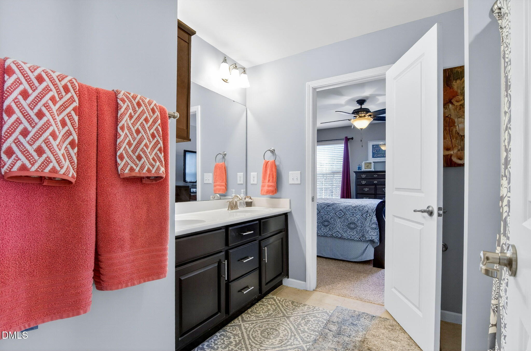 307 Marbella Drive Rolesville, NC 27571 - Photo 45 of 65 a en suite bathroom with a double vanity sink a mirror and a shower
