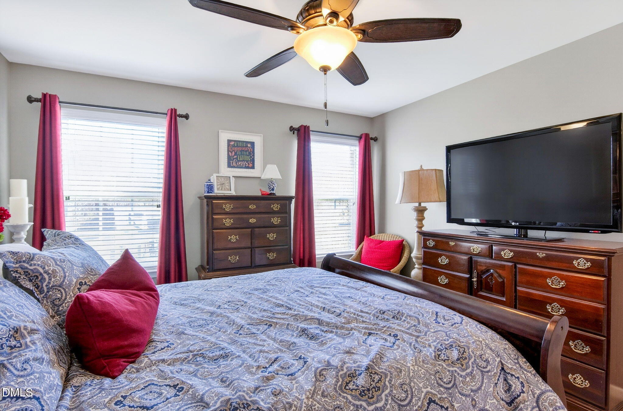 307 Marbella Drive Rolesville, NC 27571 - Photo 47 of 65 a bedroom with a bed and a flat screen tv