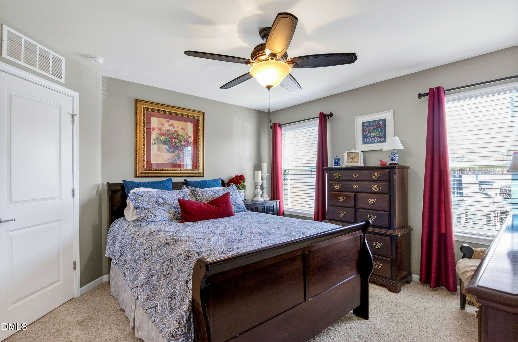 307 Marbella Drive Rolesville, NC 27571 - Photo 48 of 65 a bedroom with a bed and a chandelier