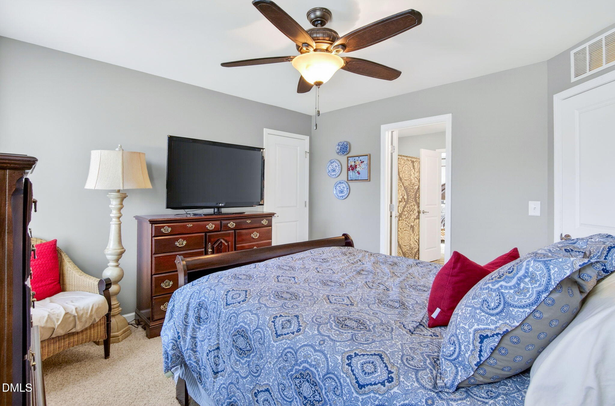 307 Marbella Drive Rolesville, NC 27571 - Photo 49 of 65 a bedroom with a bed and a flat screen tv