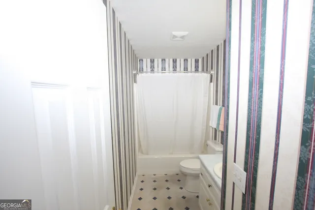a view of a bathroom from a hallway