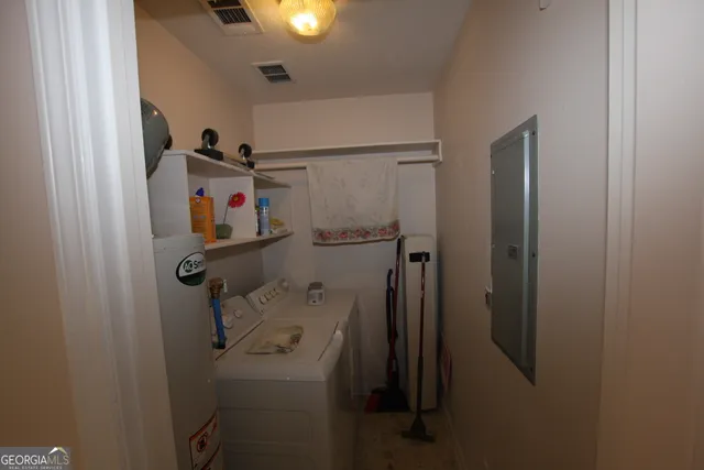 a bathroom with a shower and a sink