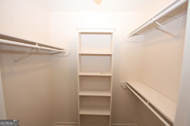 a view of an empty walk in closet
