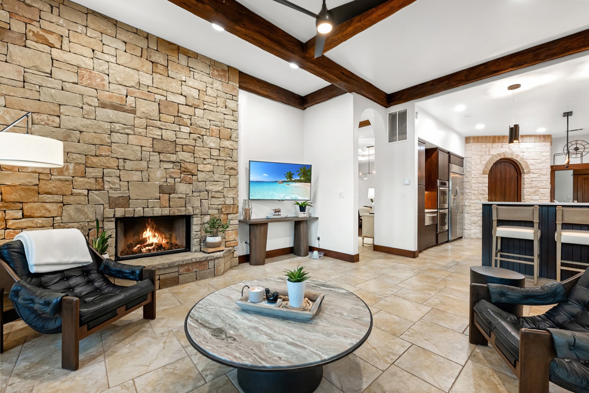 407 Hurst Creek Road Lakeway, TX 78734 - Photo 12 of 40 Floor to ceiling stone fireplace keeps this family room feeling cozy. More BEAUTIFUL stained wood architectural details.