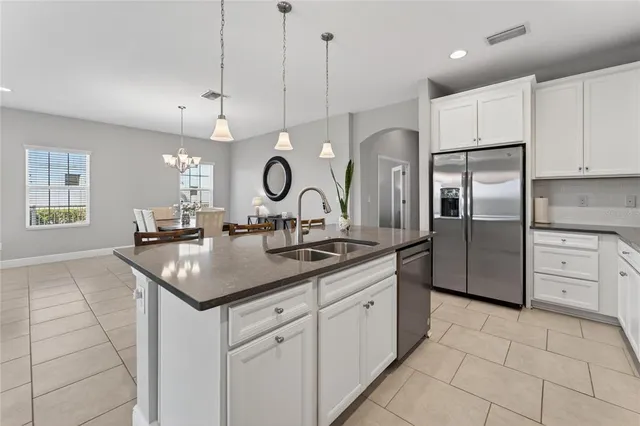 a view of walk in closet with clothes