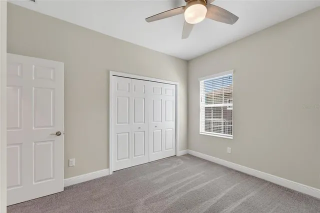 an aerial view of residential houses with outdoor space and lake view