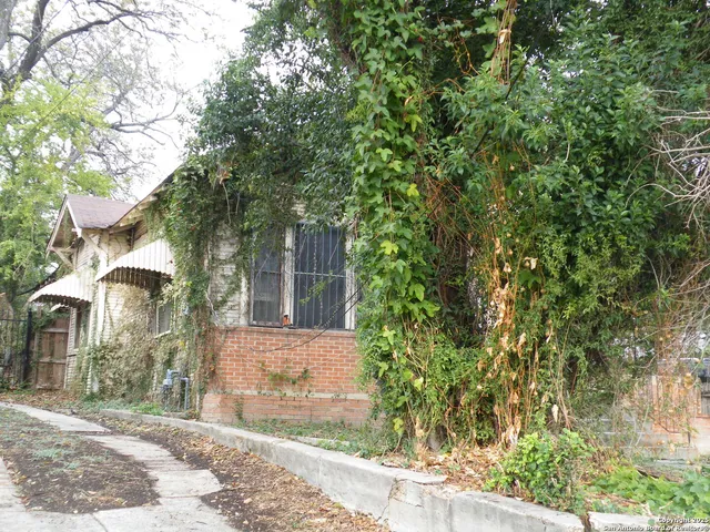 a view of a house with a tree