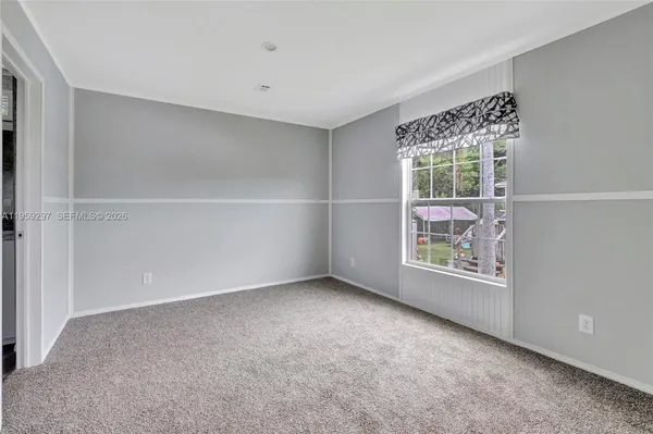 an empty room with windows