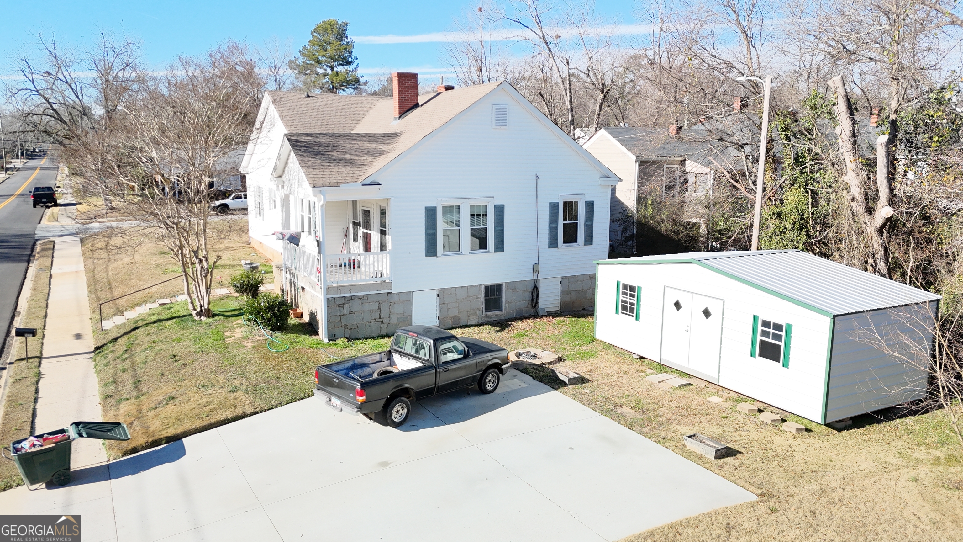 155 Myrtle Street Elberton, GA 30635 - Photo 1 of 1 a view of a white house in front of a yard