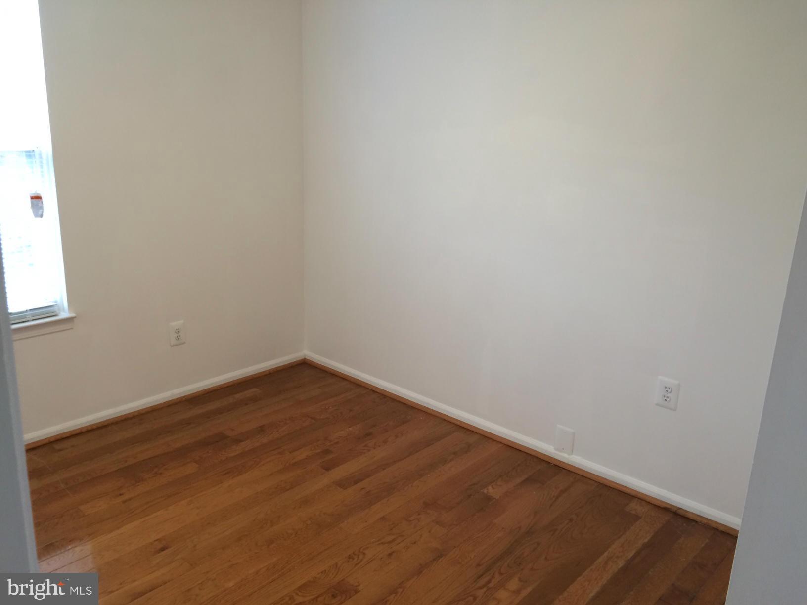 6944 Villa-Del-Rey Court Springfield, VA 22150 - Photo 9 of 14 a view of an empty room with wooden floor