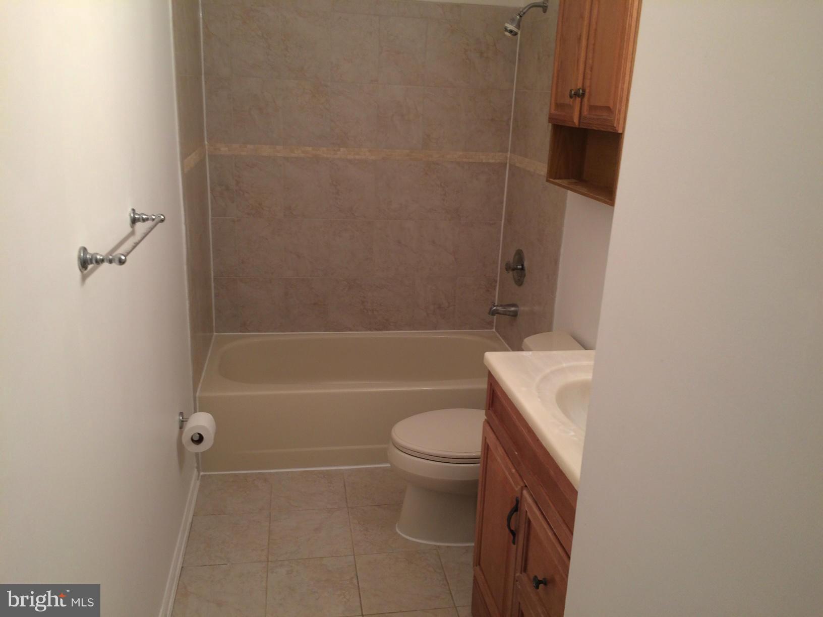 6944 Villa-Del-Rey Court Springfield, VA 22150 - Photo 10 of 14 a bathroom with a sink a toilet and shower