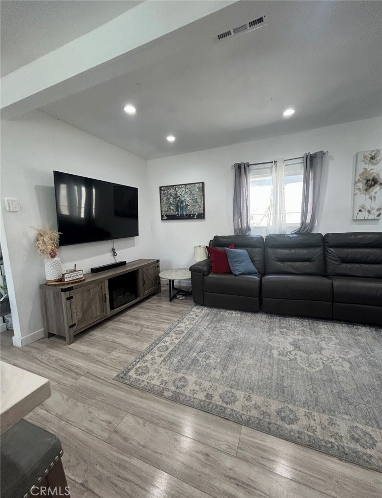 1715 West 155th Street Compton, CA 90220 - Photo 3 of 7 a living room with furniture and a flat screen tv