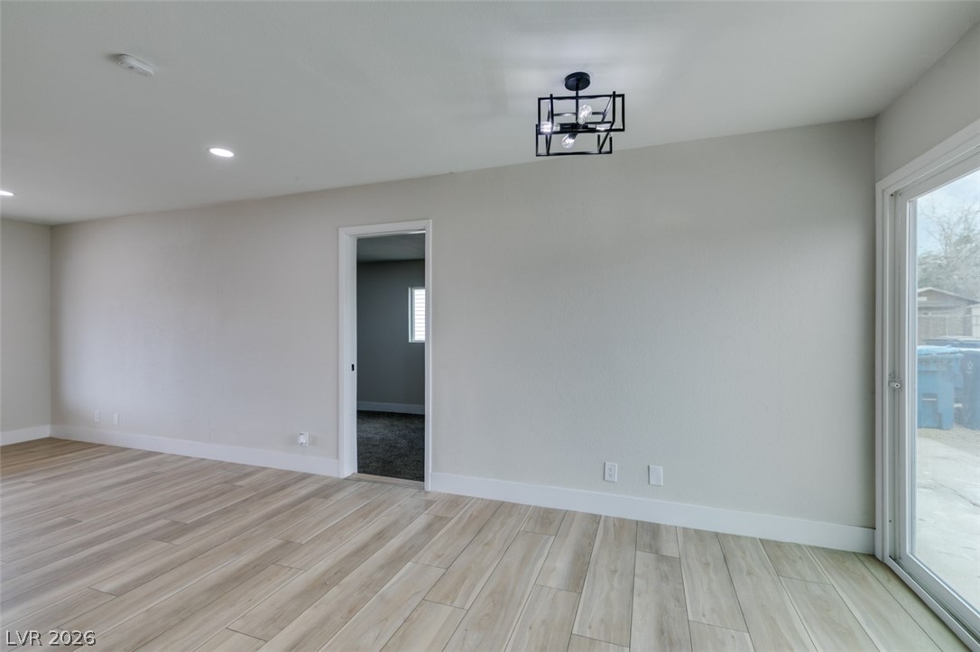 4036 Maple Hill Road Las Vegas, NV 89115 - Photo 19 of 43 Clean lines and light-toned flooring define this spacious room, awaiting your personal touch.
