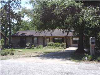 198 Ridge Lake Road Crestview, FL 32536 - Photo 1 of 1 a front view of a house with garden
