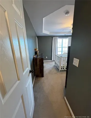 a bedroom with a bed next to a window