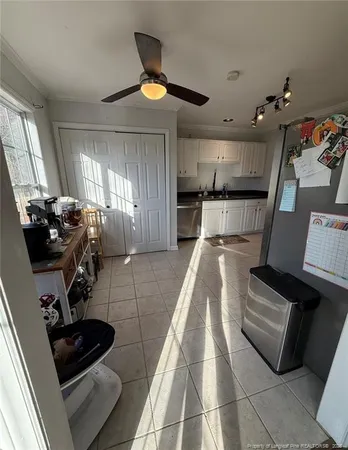 a kitchen with stainless steel appliances granite countertop a refrigerator and a stove