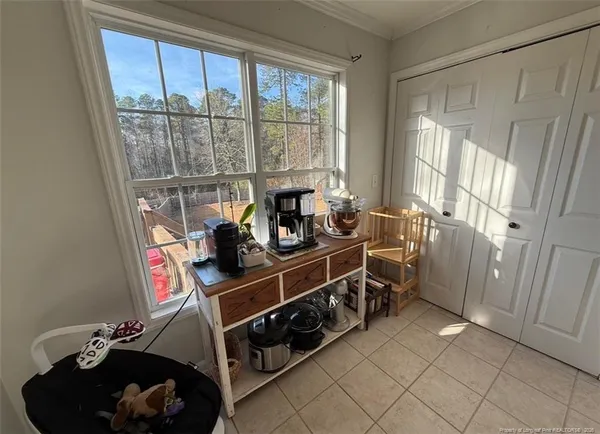 a large kitchen with stainless steel appliances kitchen island granite countertop a refrigerator and a stove top oven