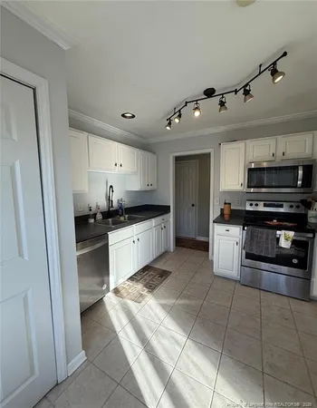 a bedroom with a bed and a rug