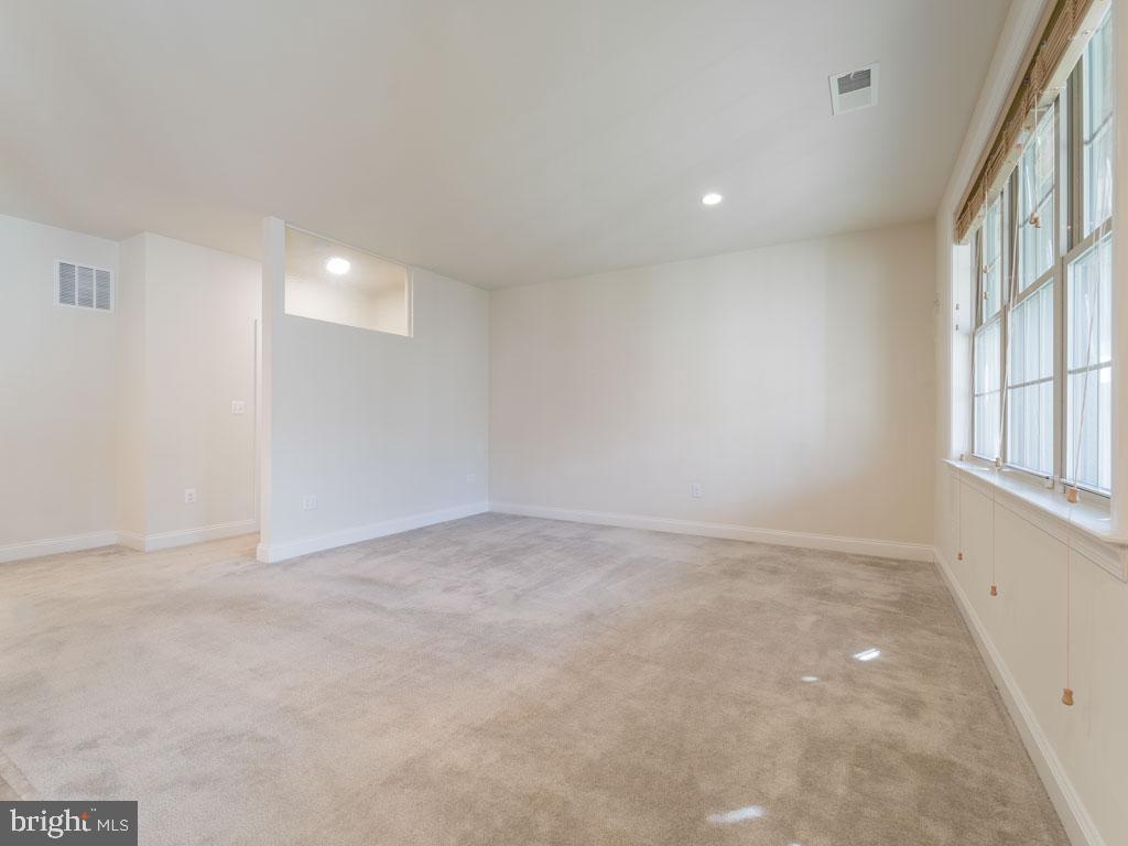 22595 Windsor Locks Square Ashburn, VA 20148 - Photo 31 of 56 an empty room with windows and entrance