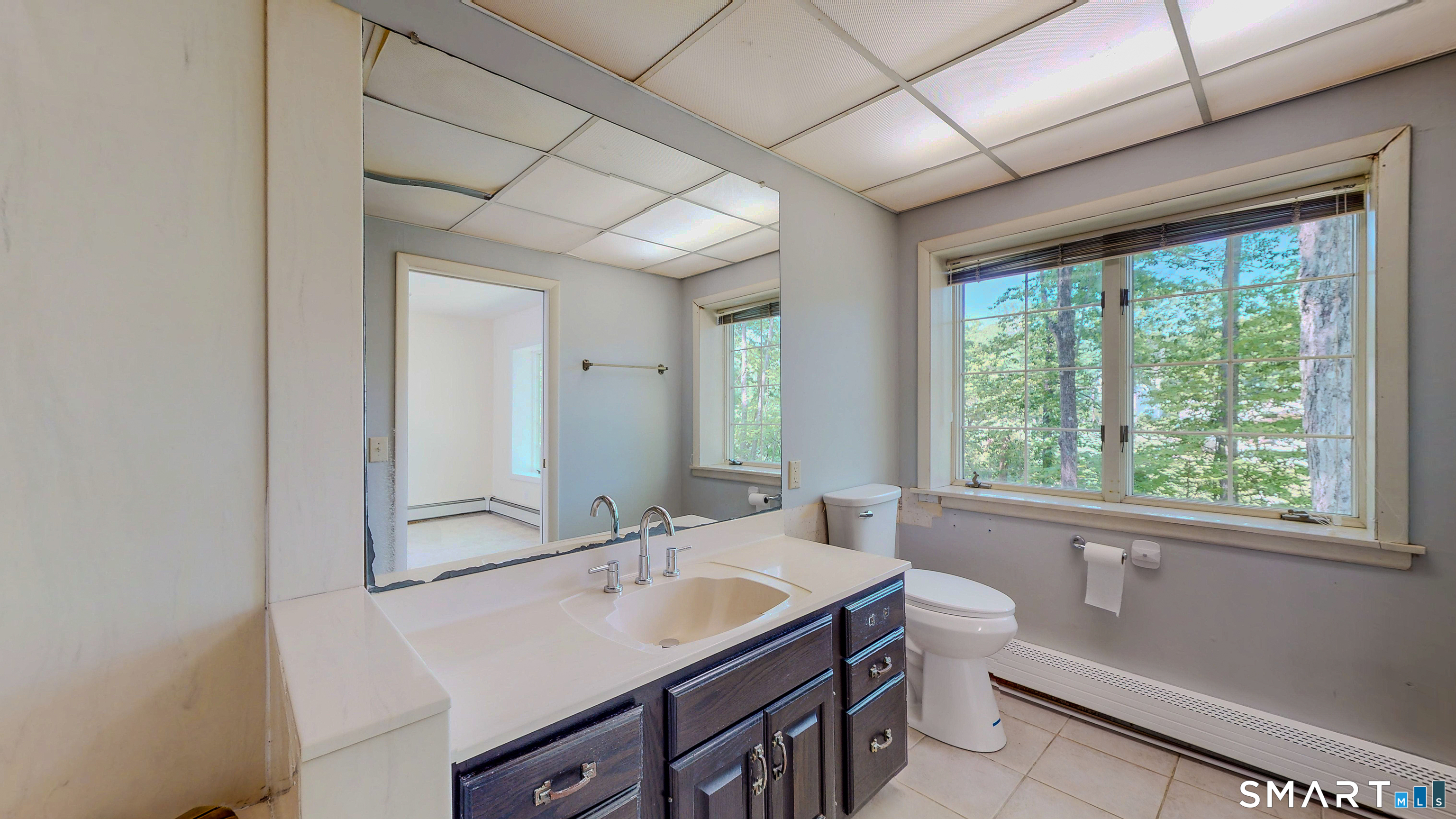 133 Chambers Road Danbury, CT 06811 - Photo 17 of 30 a bathroom with a sink double vanity and a large mirror