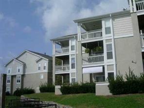1301 Torrence Circle Davidson, NC 28036 - Photo 3 of 5 a view of a white house with a yard and large windows