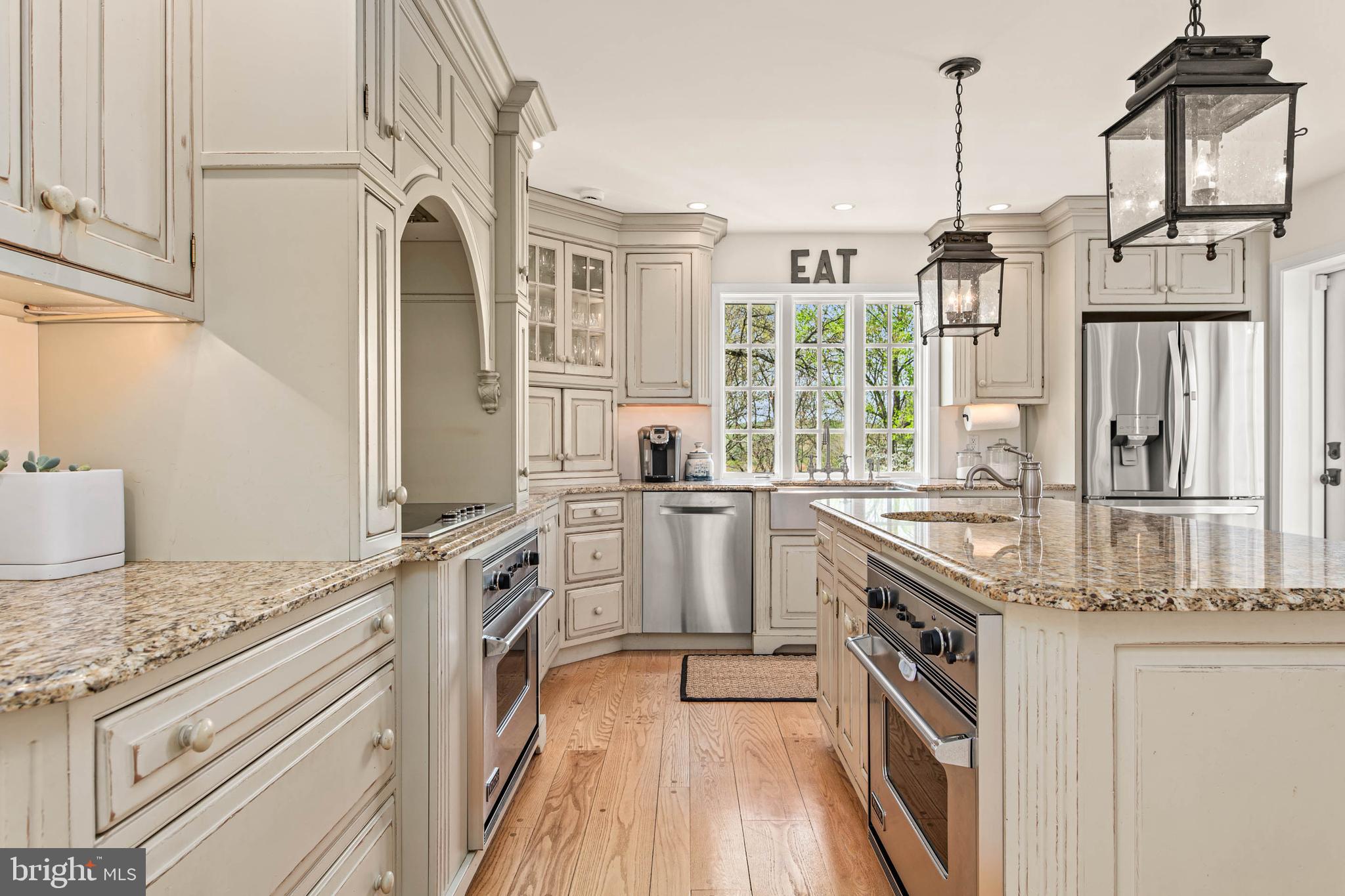 8 Rabbit Run Road Malvern, PA 19355 - Photo 11 of 49 a kitchen with granite countertop a stove and a sink